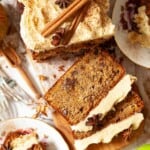 Close up of an apple loaf cake with several slices cut.