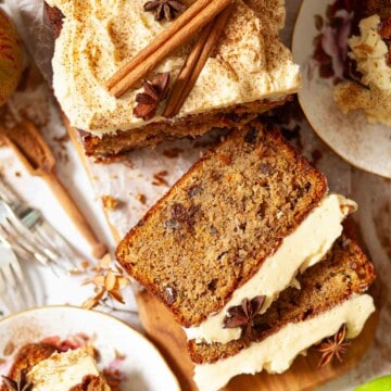 Close up of an apple loaf cake with several slices cut.