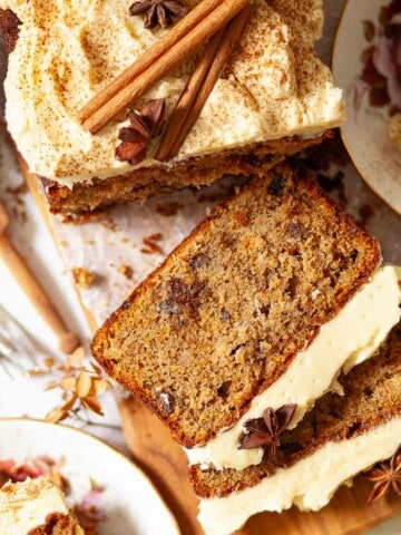 Close up of an apple loaf cake with several slices cut.