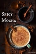 Labelled image of a spicy mocha presented in a cup and garnished with chocolate and cinnamon.