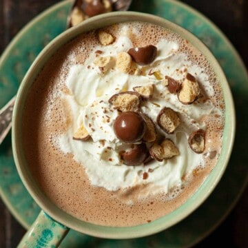 Close up of malted drinking chocolate with whipped cream and Crushed Maltesers.