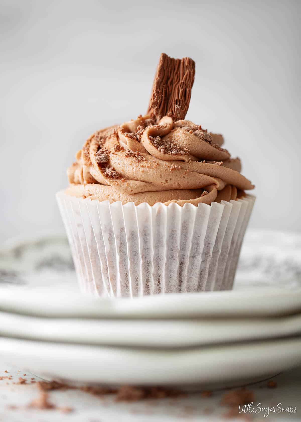 A Cadbury cupcake made with Dairy Milk chocolate and garnished with a piece of Cadbury Flake.