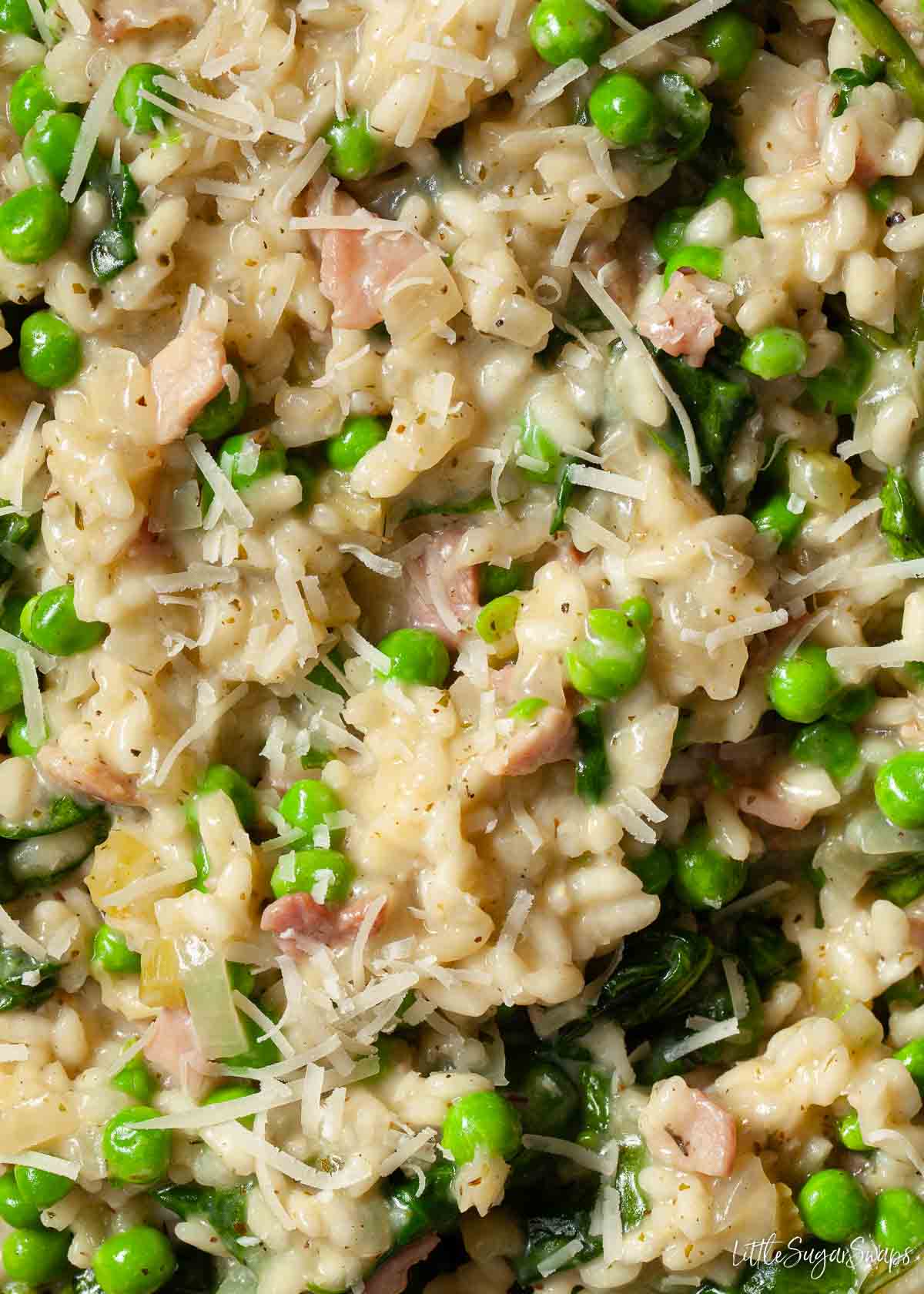 Close up of creamy pea and bacon risotto.