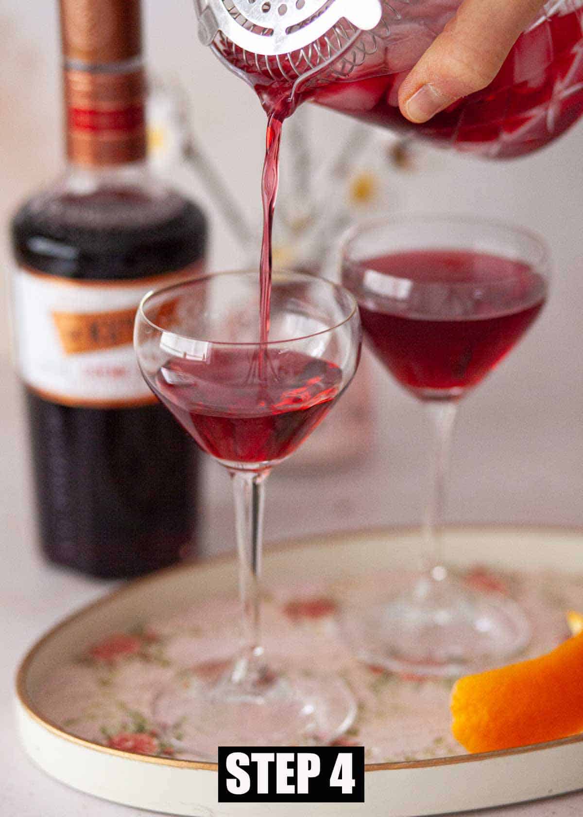 Pouring a Parisian cocktail into a Nick and Nora glass.