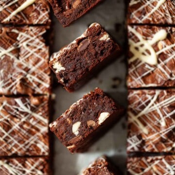 Close up of mixed chocolate brownies on their side to reveal chocolate chips.