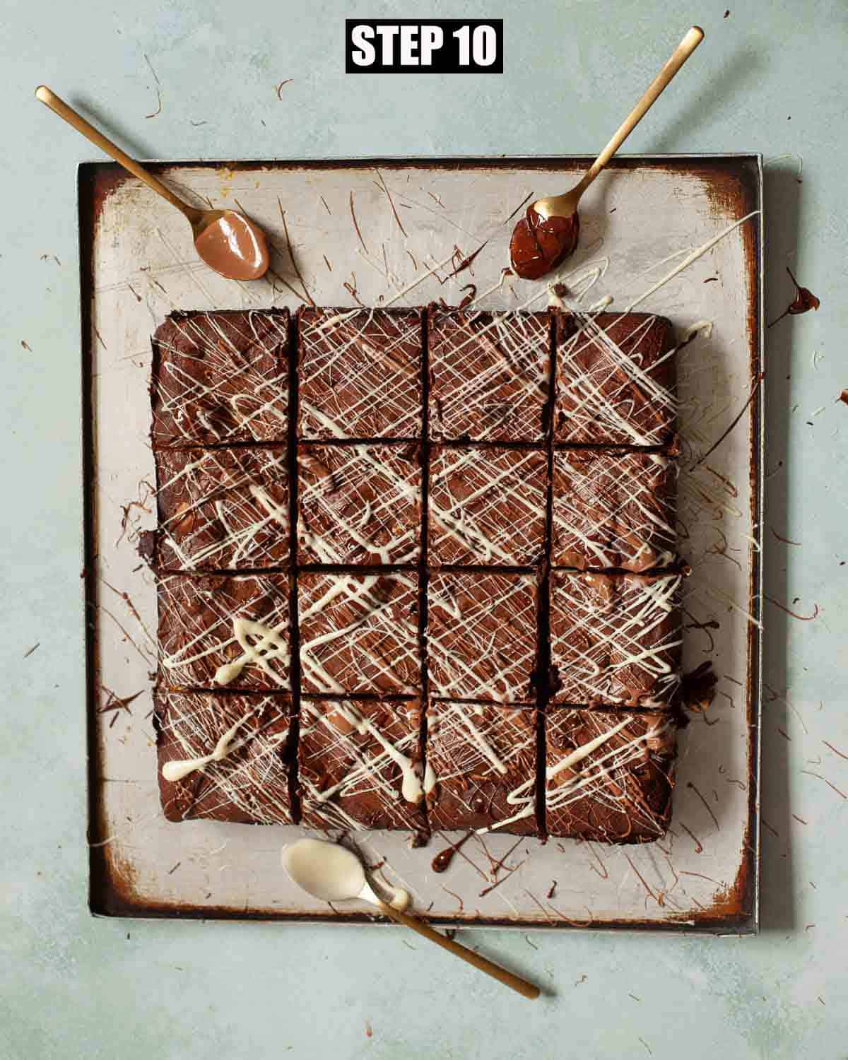 Choc chip brownies cut into squares and topped with three types of chocolate.