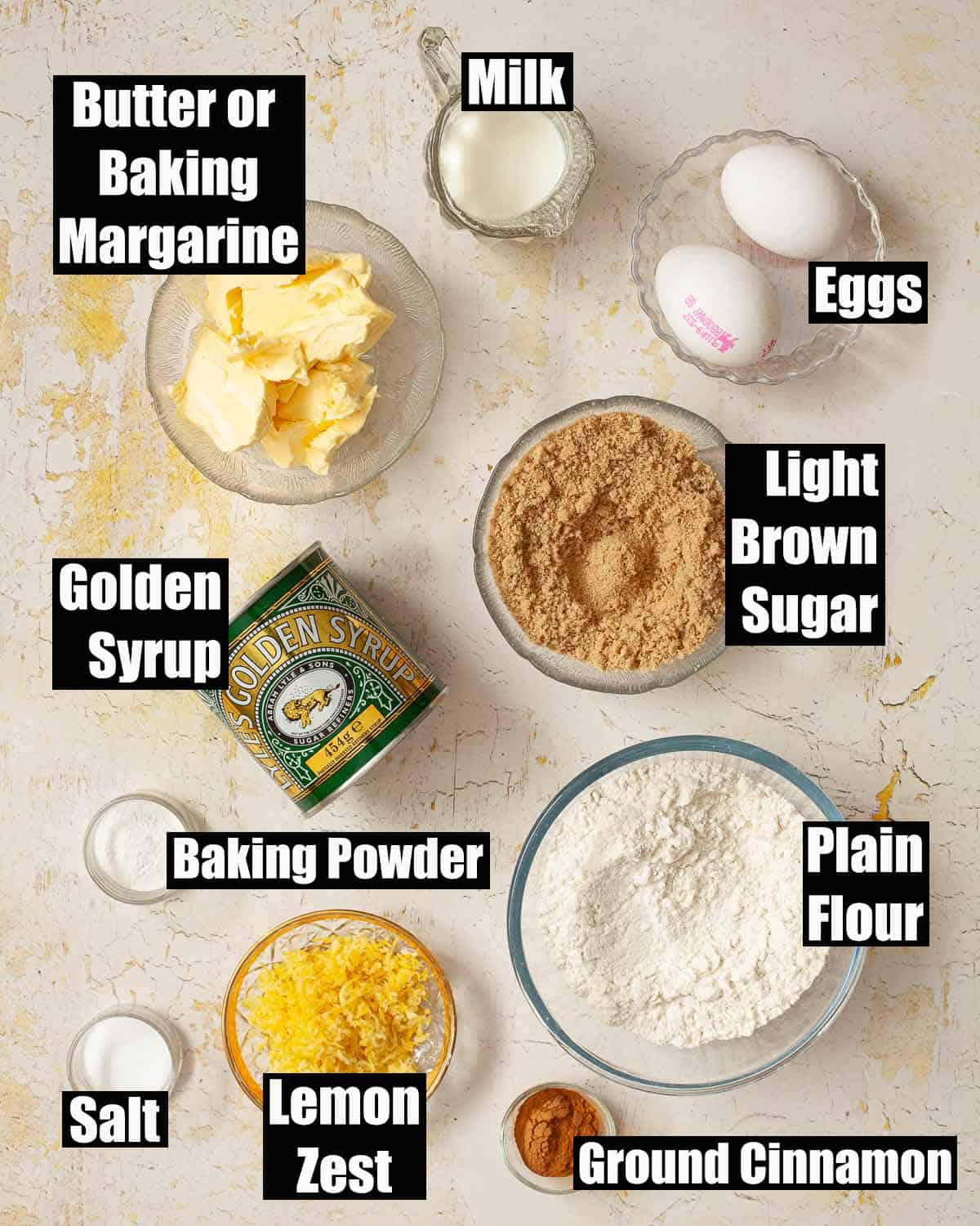 Labelled ingredients for a loaf cake with golden syrup featuring as the flavour.