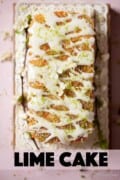 Lime cake with drizzle topping and icing with text overlay.