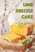 A part sliced lime drizzle cake with text overlay.