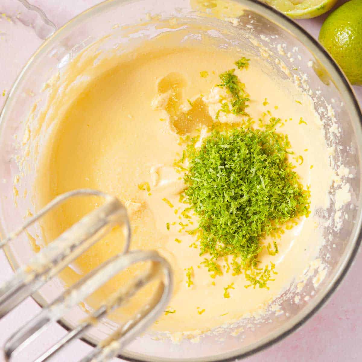 Lime zest and juice tipped into cake batter.