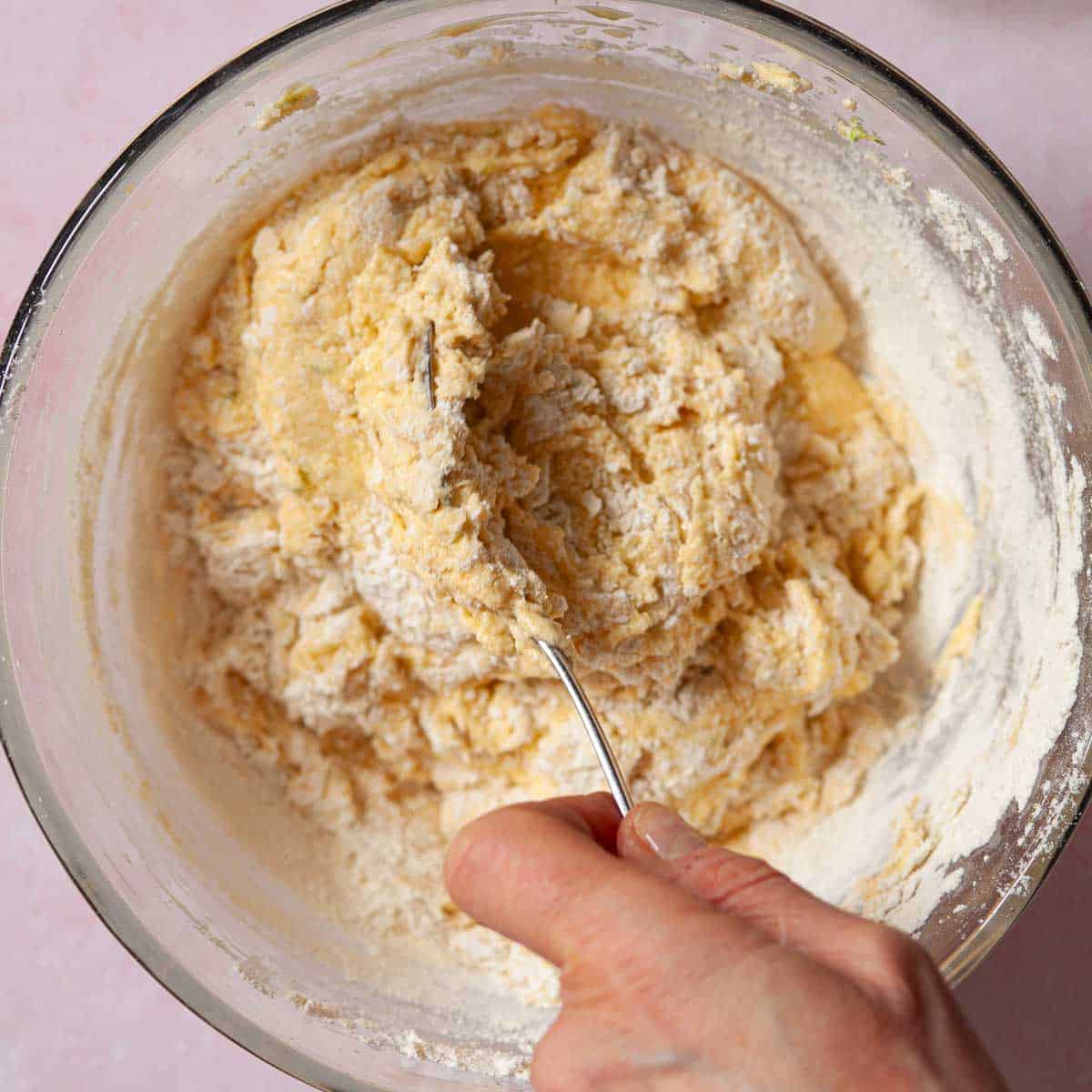 Flour being mixed into cake batter.