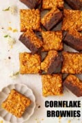 Caramel cornflake brownie squares with a few on their side to reveal the layers with text overlay.