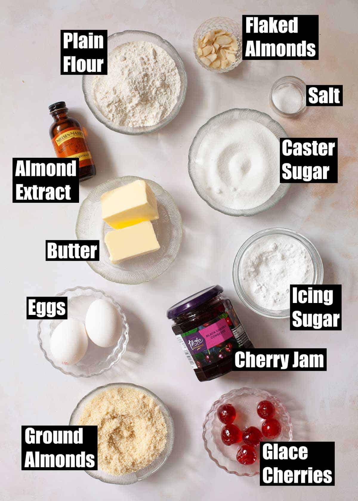 Labelled ingredients for a cherry and almond tart.