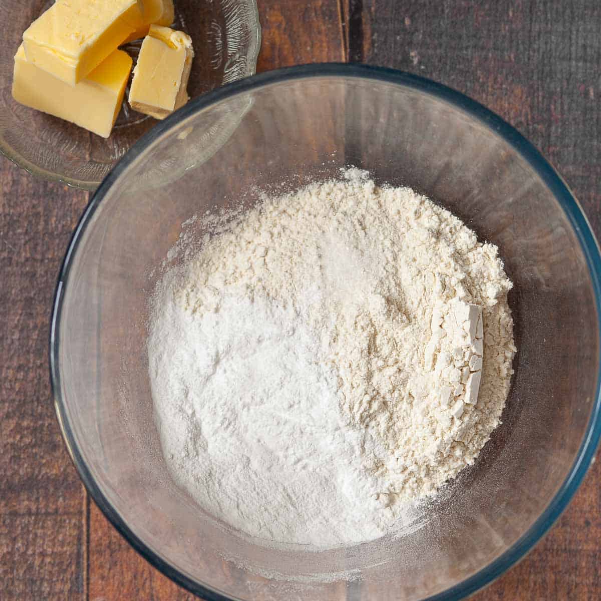 Flour and icing sugar in a mixing bowl.