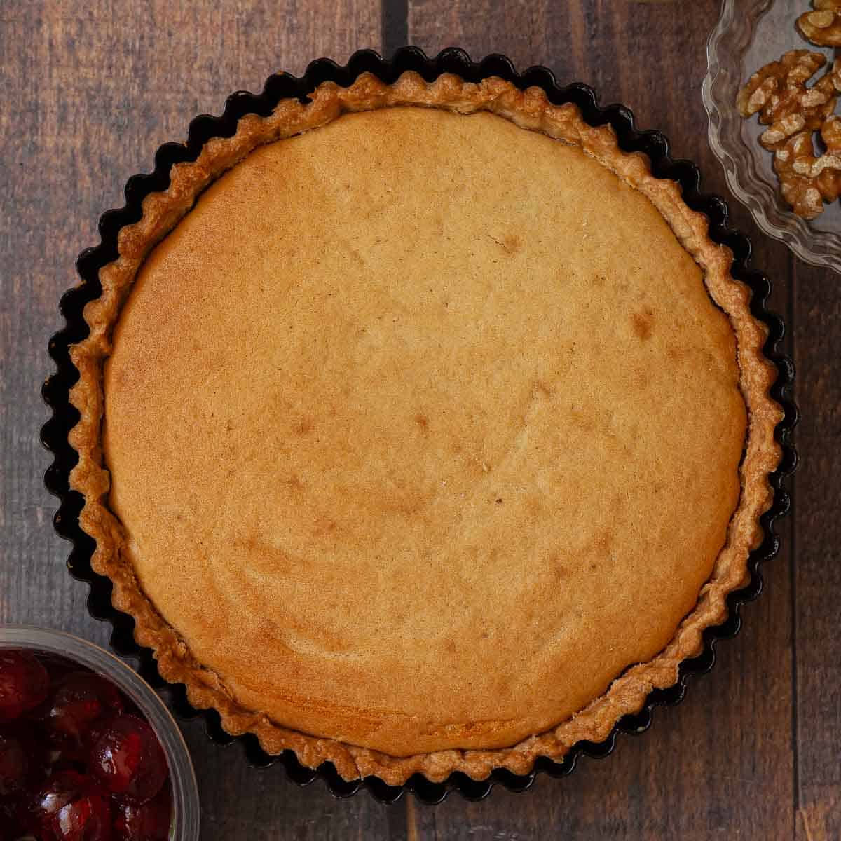 A baked jam and sponge cake with a pastry base.