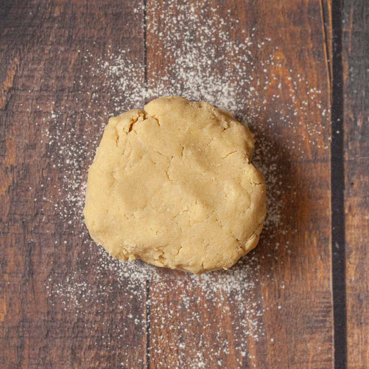 Shortcrust pastry dough on a lightly floured table top.