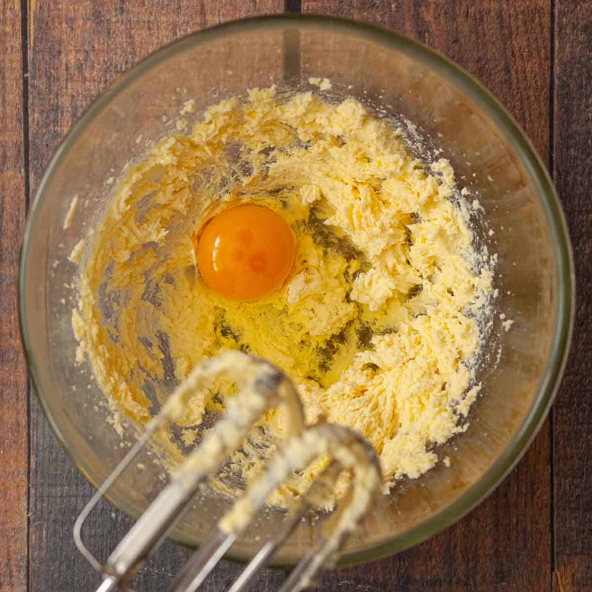 Cram butter and sugar with an egg about to be beaten into it.