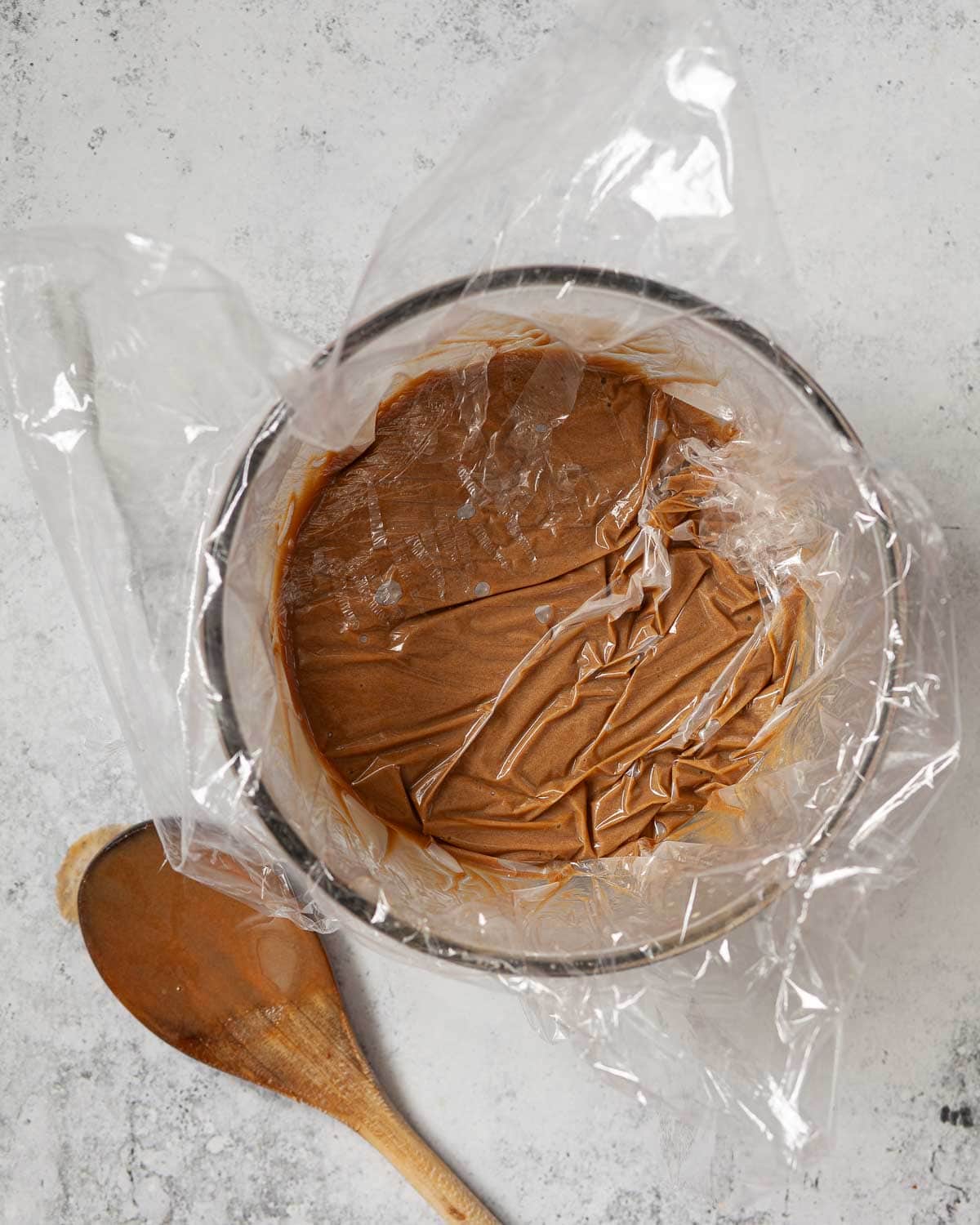 Custard base for ice cream in a bowl and covered in food wrap.