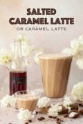 Glasses of salted caramel latte with caramel syrup in the background with text overlay.