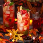 Red strawberry flavoured mojito cocktails in an autumnal setting.