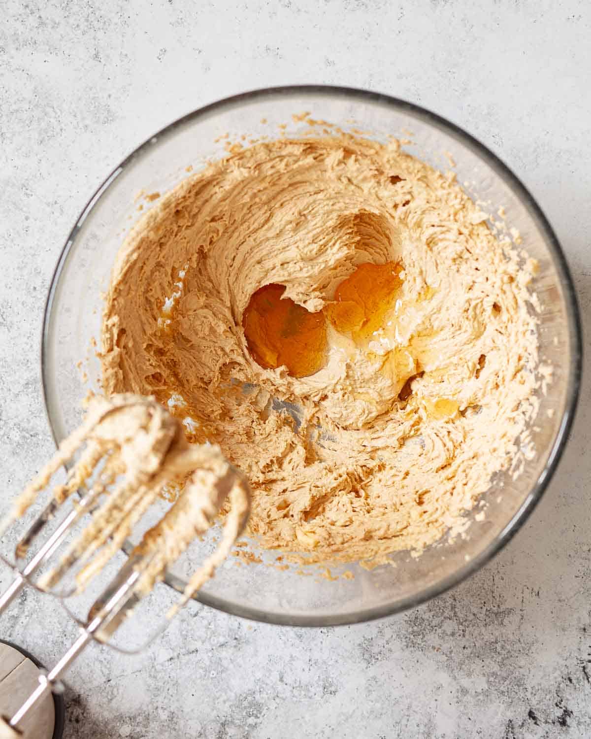 Honey about to be beaten into cake batter.
