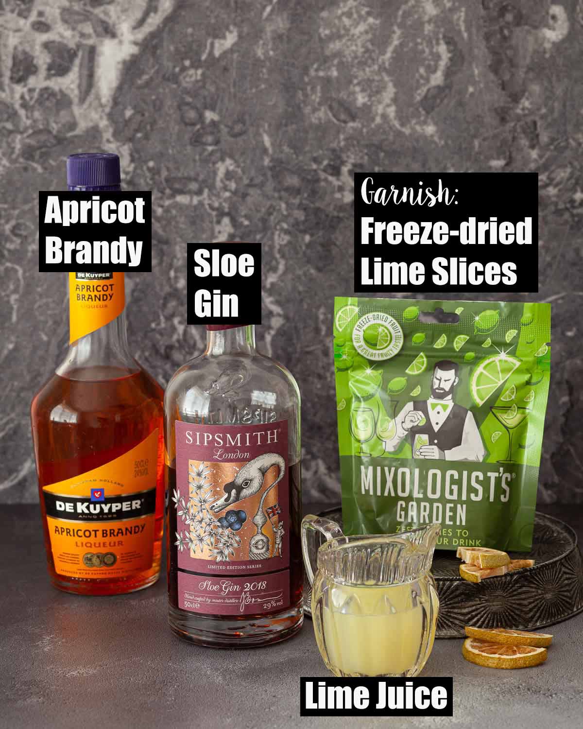Labelled ingredients for a vintage cocktail with sloe gin and apricot brandy.