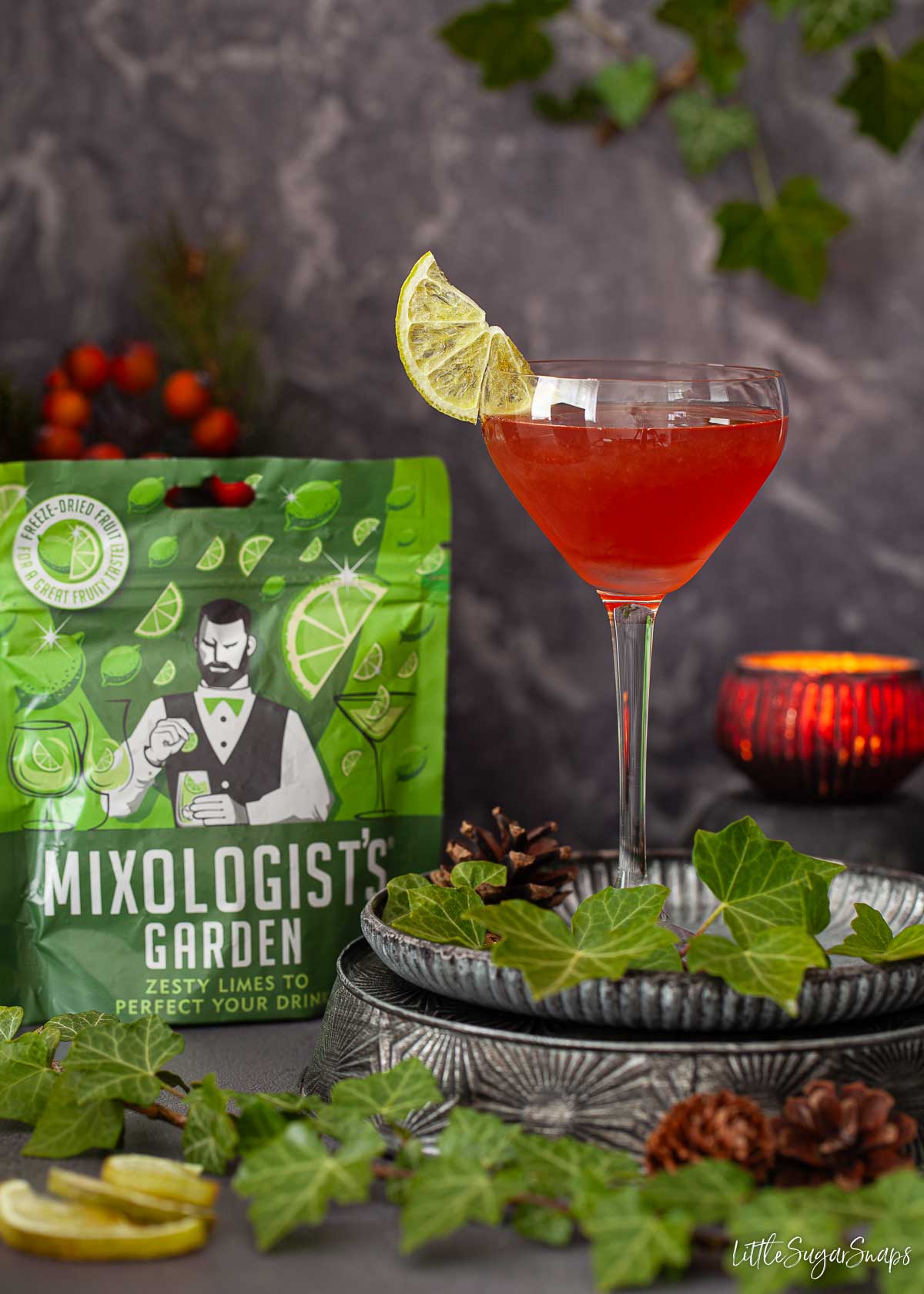 A vintage cocktail made with sloe gin and apricot brandy garnished with a lime slice.