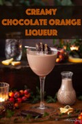 Brandy chocolate liqueur garnished with chocolate dipped candied orange with text overlay.