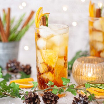 Close up of a prosecco and Pimms spritz cocktail in a winter setting.
