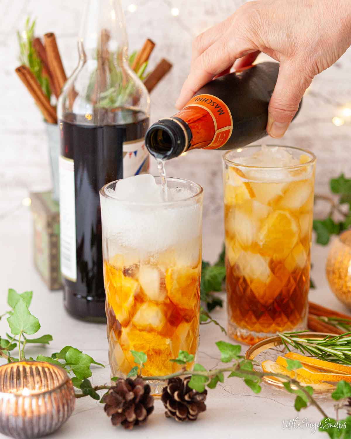 Prosecco being poured over Pimms.
