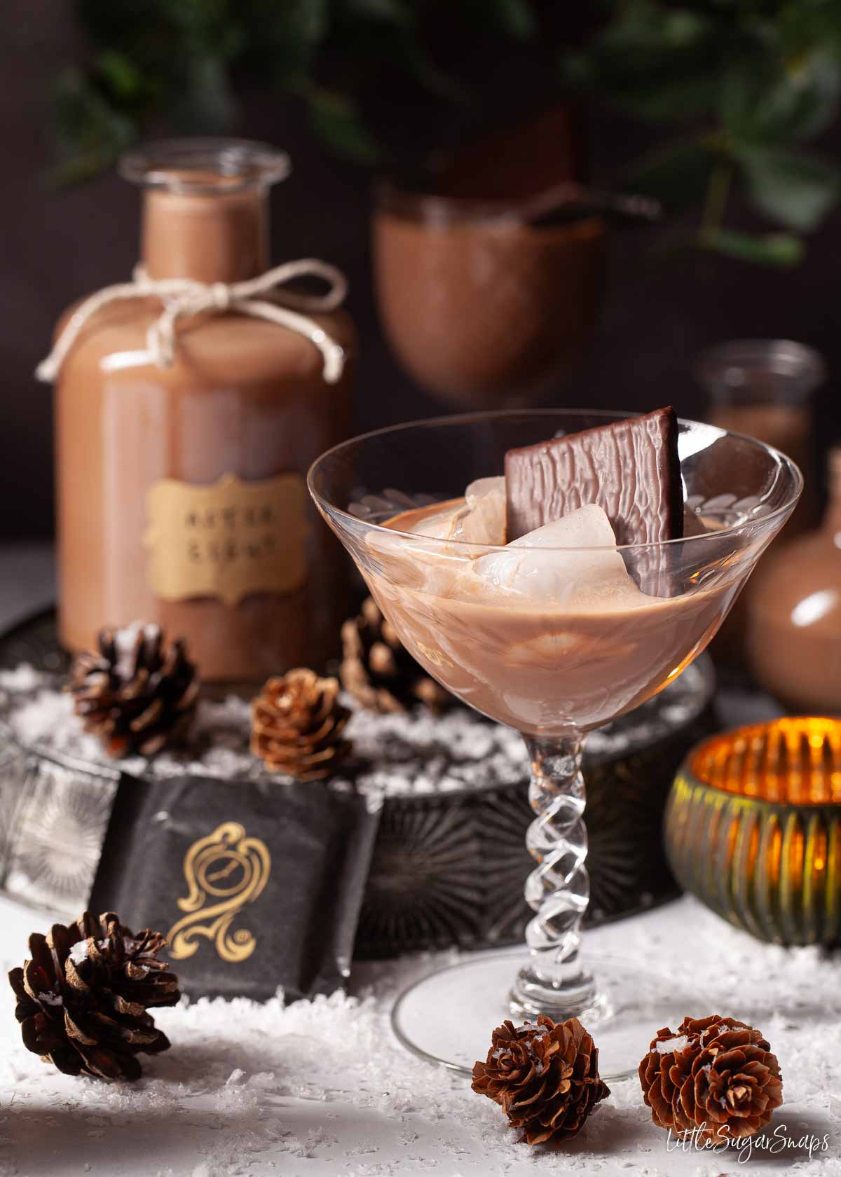 Peppermint cream liqueured and ice in a glass.