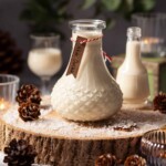 Close up of a bottle of white chocolate liqueur in a festive setting.