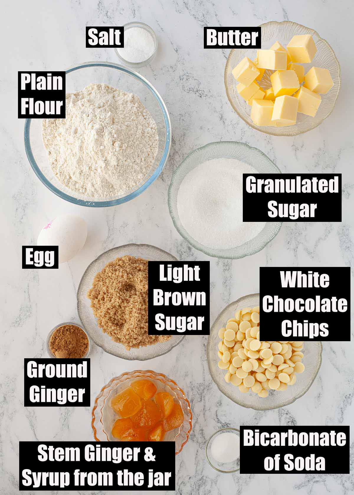 Labelled ingredients for soft stem ginger cookies with white chocolate.