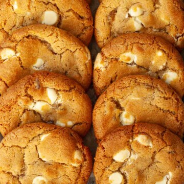 Close up of soft & chewy stem ginger cookies with white chocolate chips.