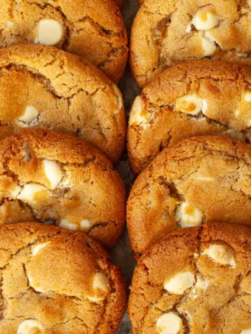 Close up of soft & chewy stem ginger cookies with white chocolate chips.