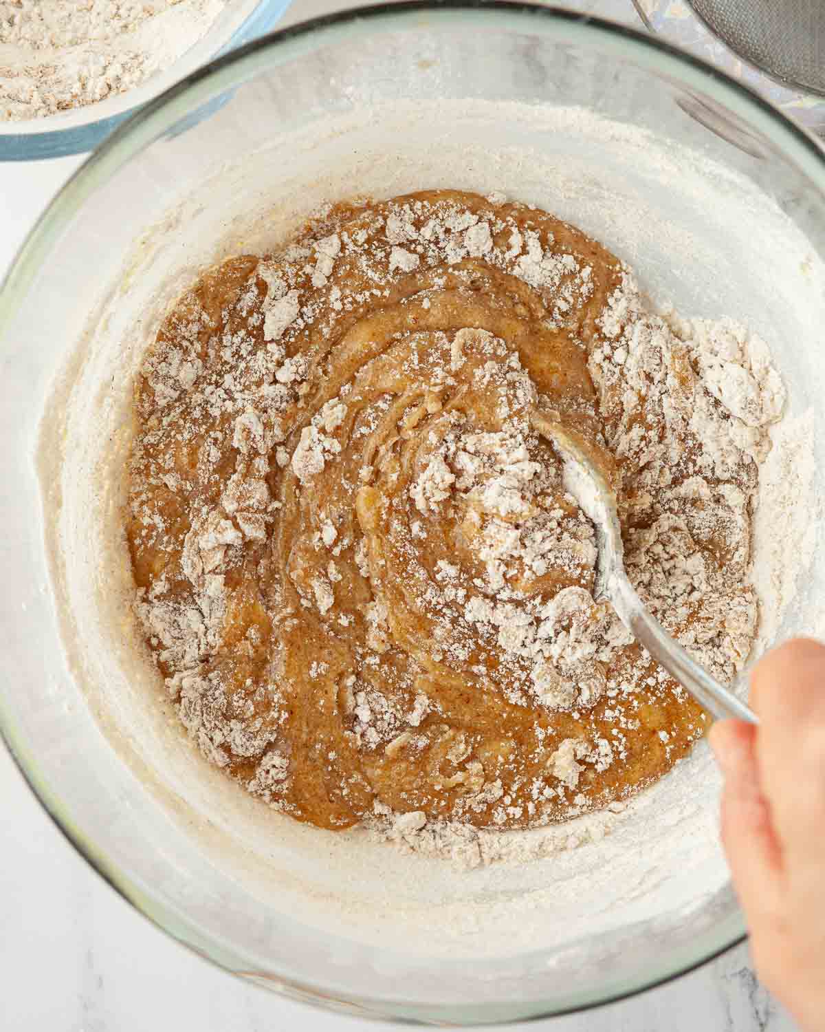 Flour being stirred into cookie dough,