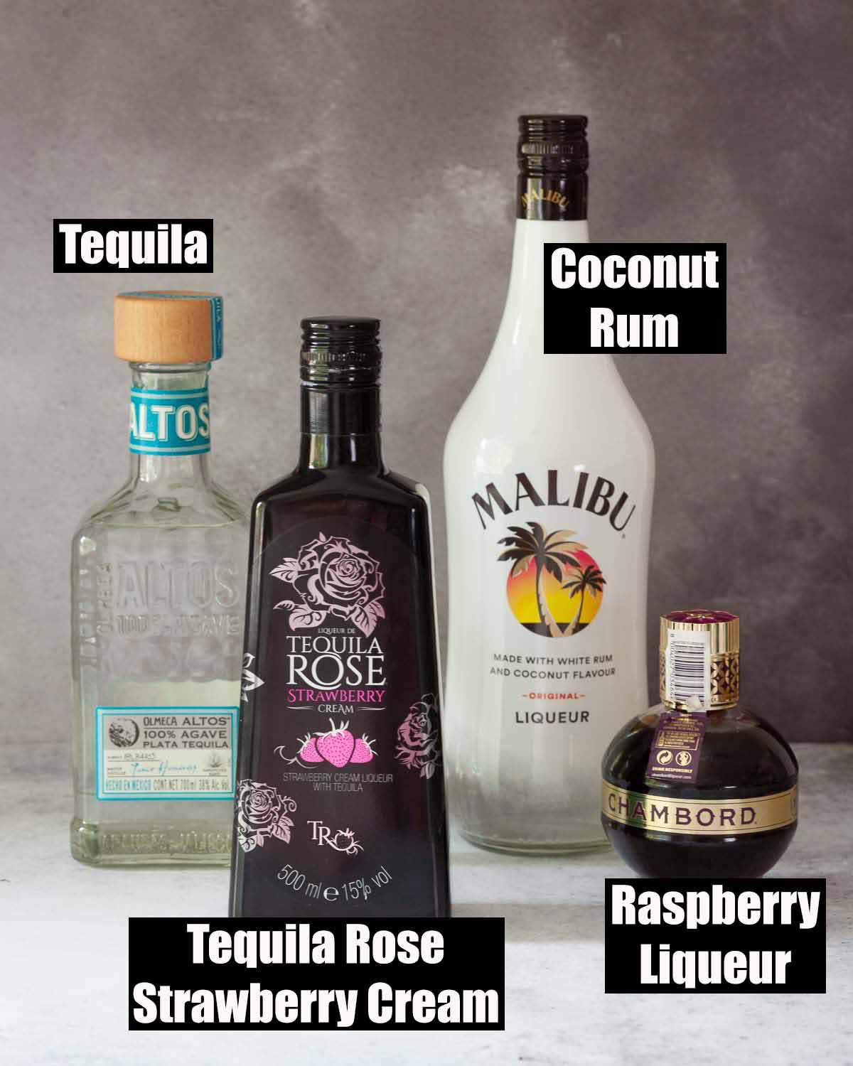 Labelled ingredients for a strawberry Tequila Rose liqueur cocktail