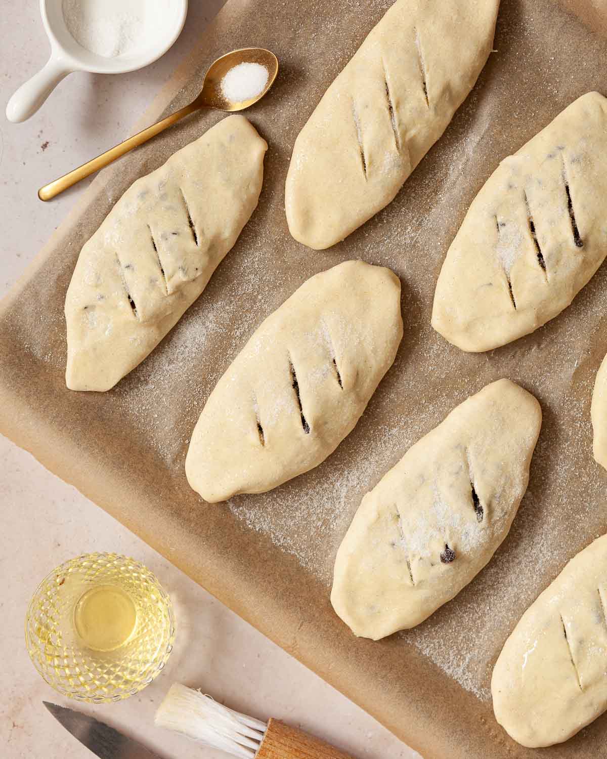 Banbury cakes on a baking sheet sprinkled with sugar.