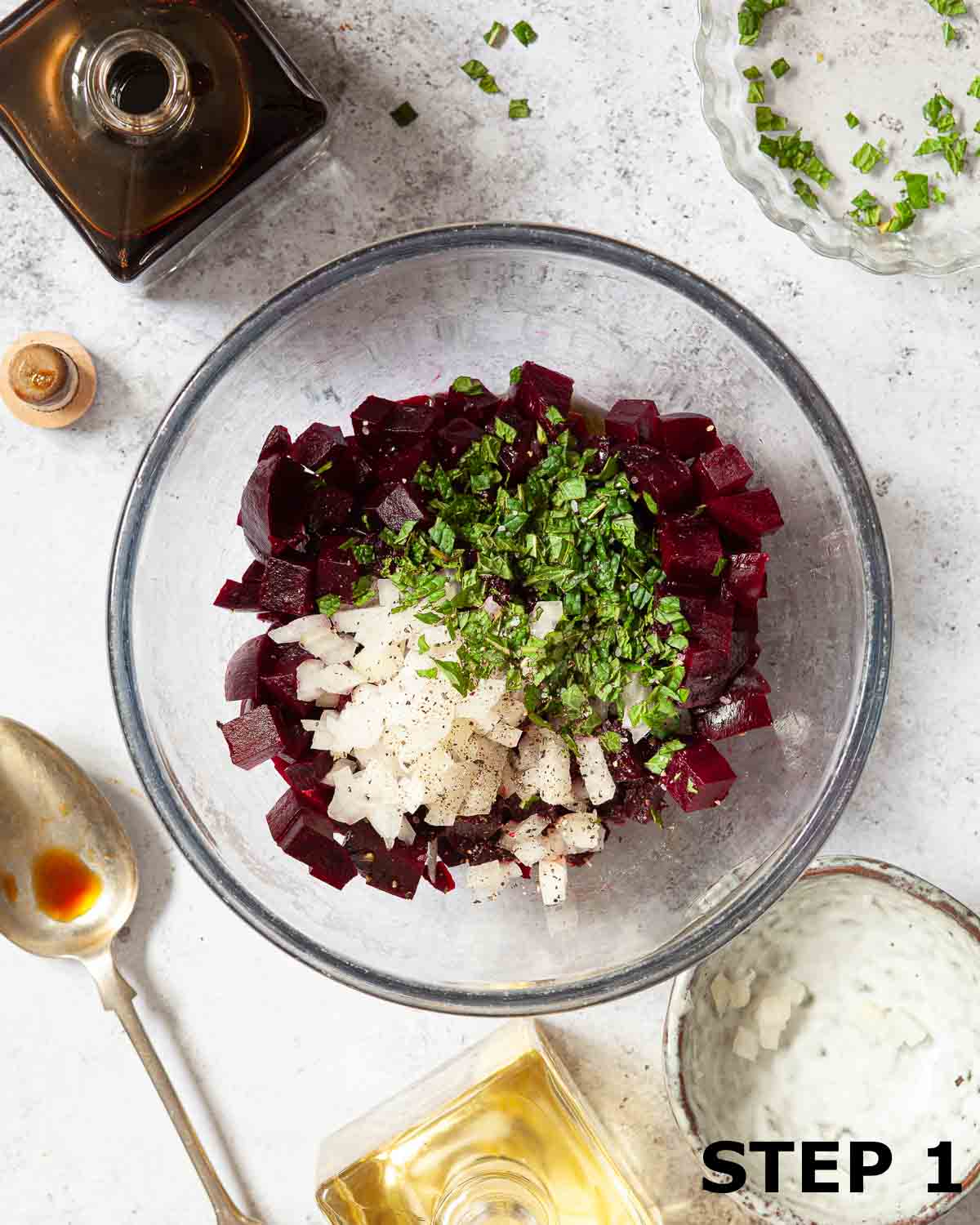 Chopped beetroot, onion and mint in a mixing bowl.