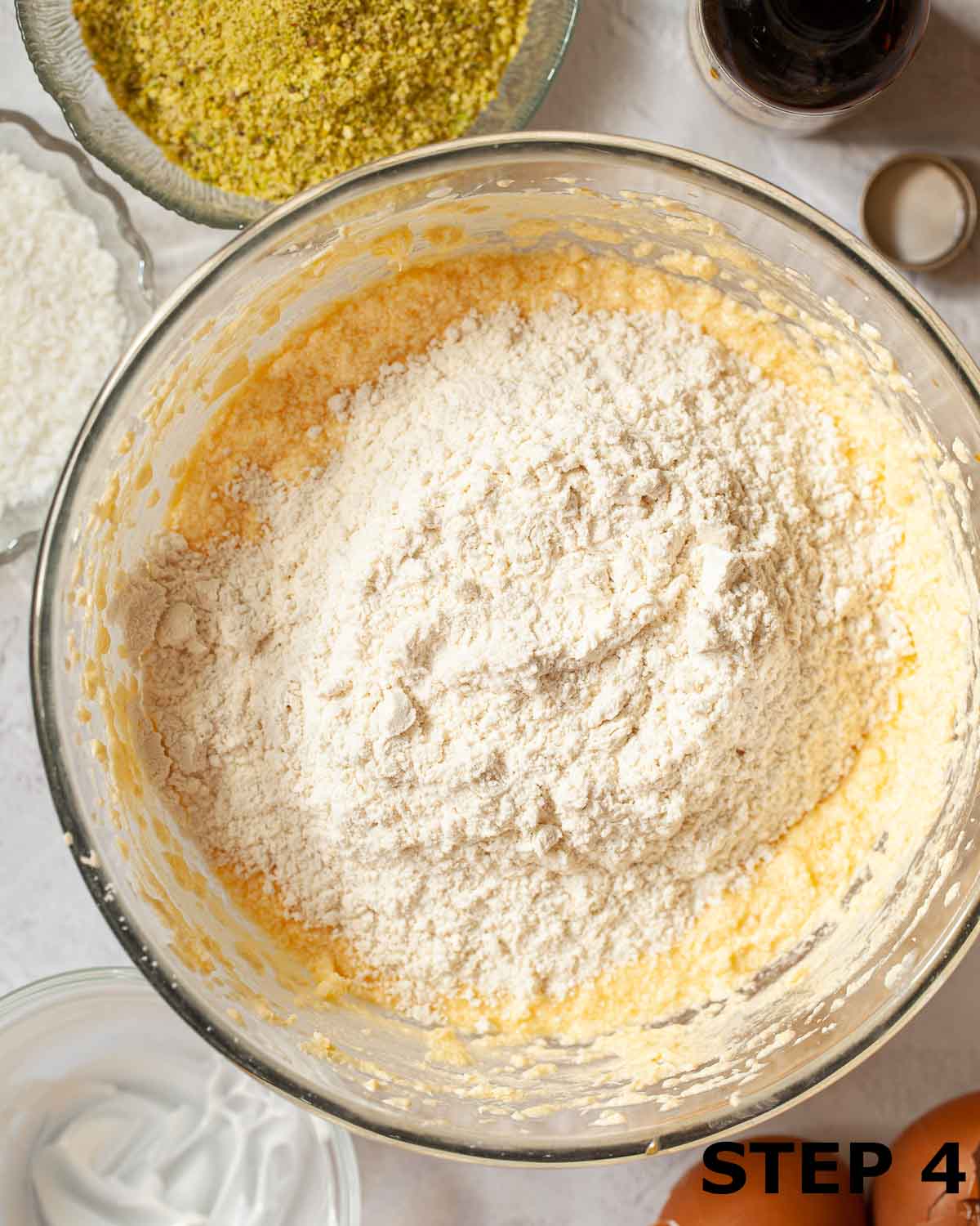 Flour in a bowl of cake batter.