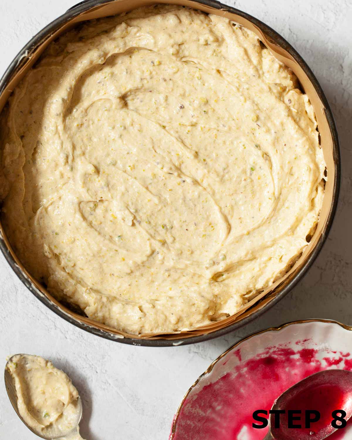 Cake batter in a lined baking tin.