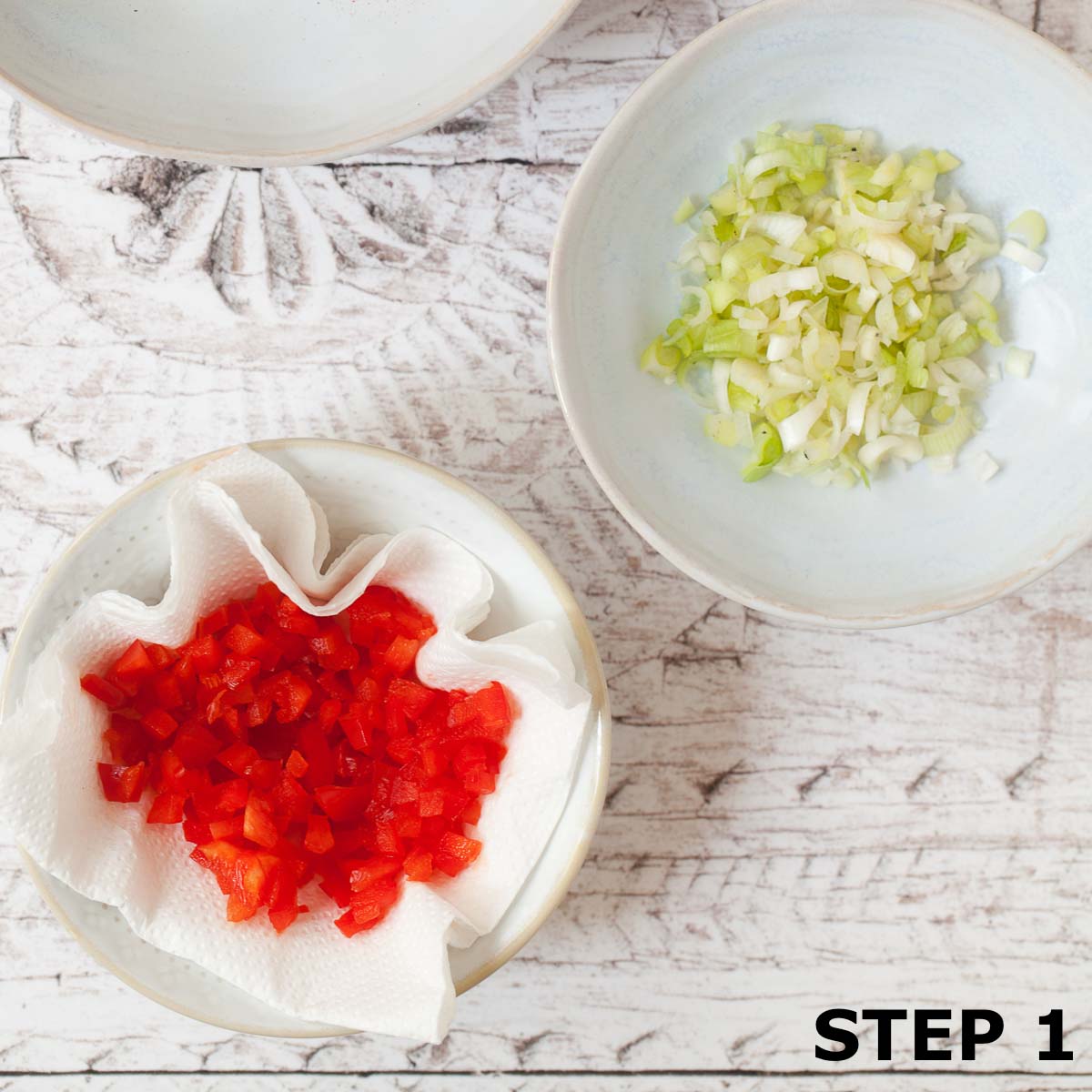 Bowls of chopped red pepper and salad onion.