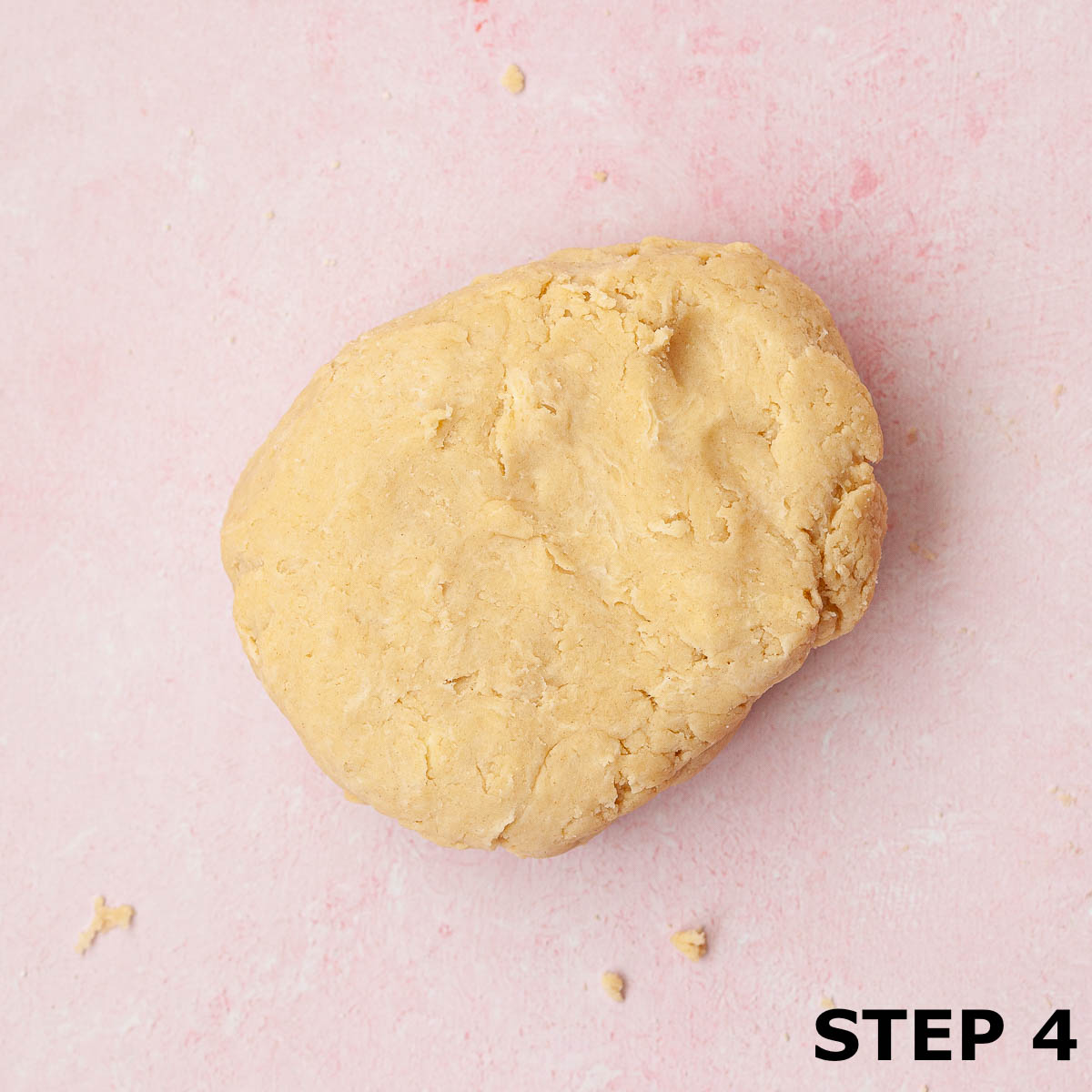 Raw shortcrust pastry dough on a worktop.