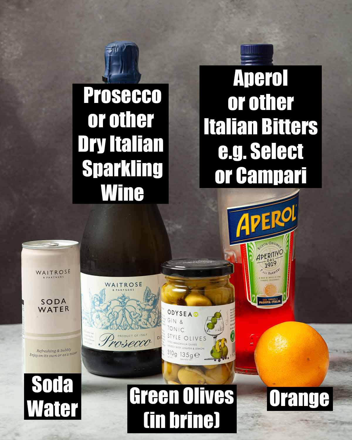 Labelled ingredients for spritz Veneziano with Aperol.