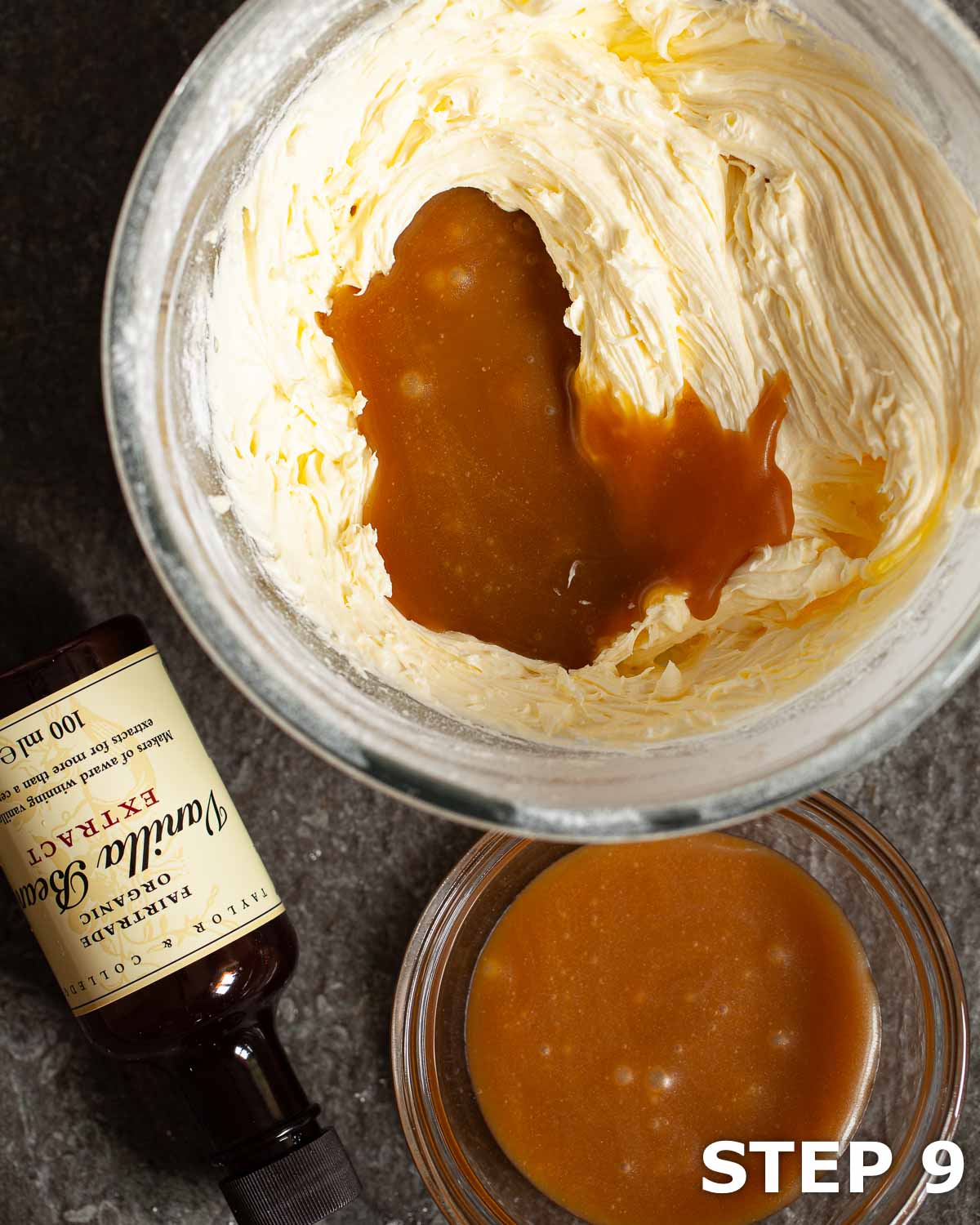 Butterscotch sauce being added to buttercream in a mixing bowl.