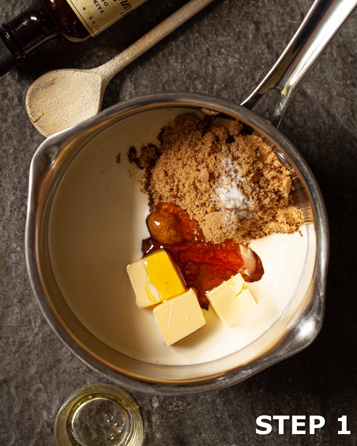 Butterscotch sauce ingredients in a pan including butter, golden syrup, brown sugar and cream.