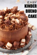 Labelled uncut chocolate Bueno cake decorated with pieces of Kinder Bueno chocolate bar.