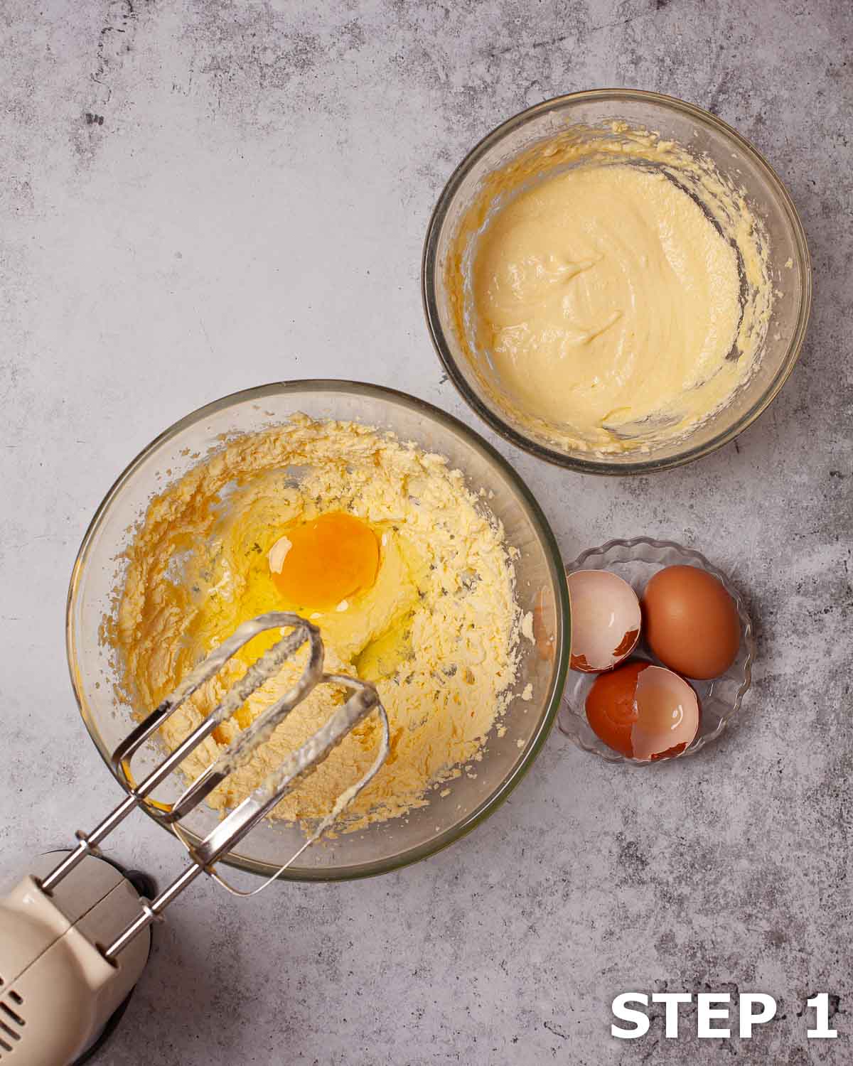 Egg about to be beaten into creamed buuter and sugar.