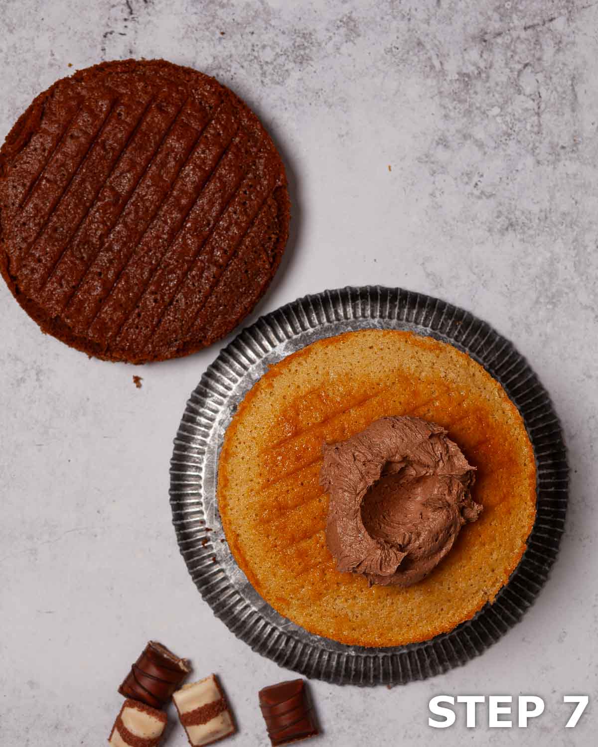 Chocolate hazelnut buttercream on a layer of vanilla sponge cake.