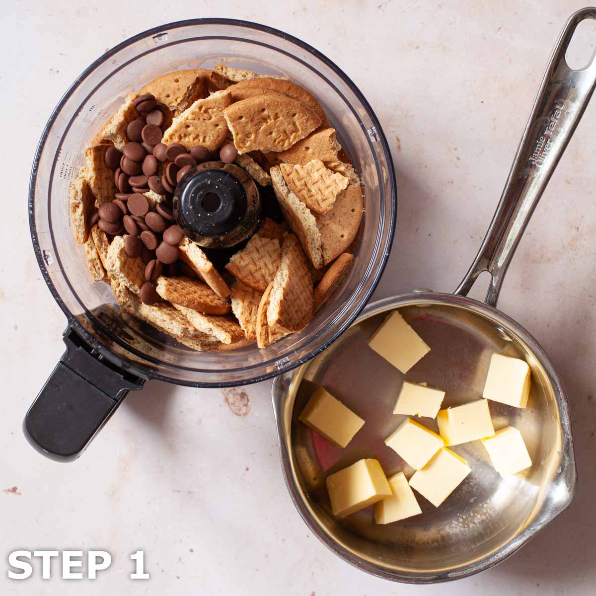 Butter in a saucepan and biscuits with chocolate chips on a food processor bowl.
